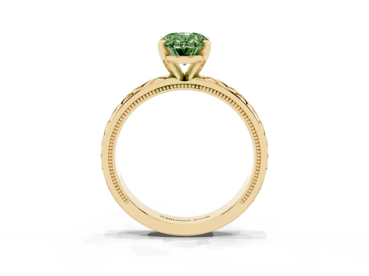 Fancy Green Oval Cut Solitaire Diamond Ring with Milgrain and Black Enamel X Pattern Band Yellow gold