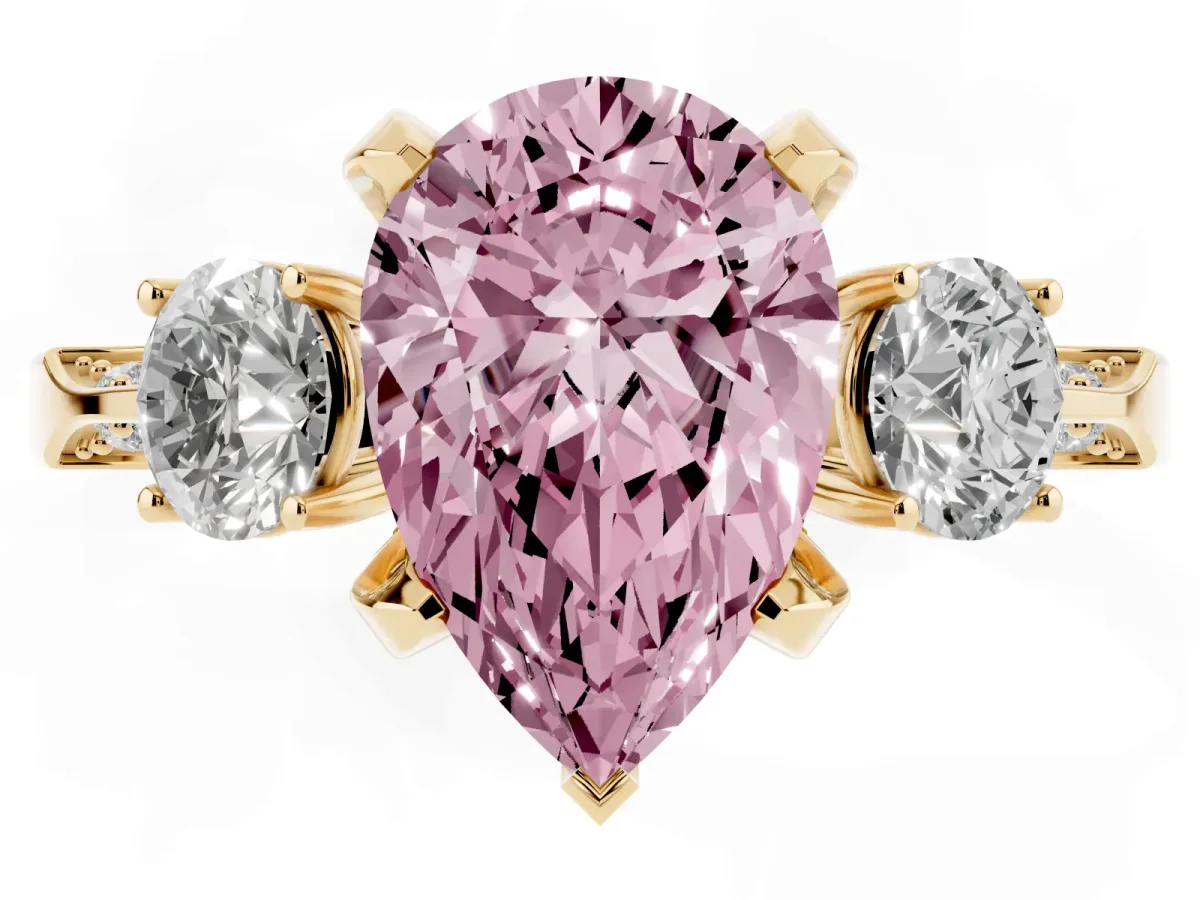 Fancy Pink Pear Cut Brilliant Three-Stone Diamond Ring with Pavé Band and Four-Prong Setting Yellow gold
