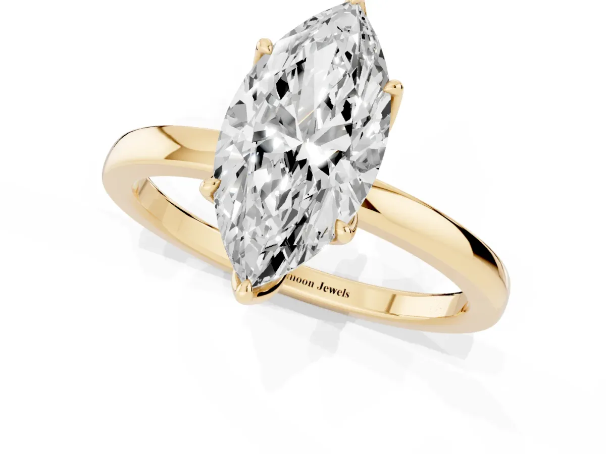 Marquise Cut Diamond Solitaire Ring with Thin Band and Prong Setting Yellow gold
