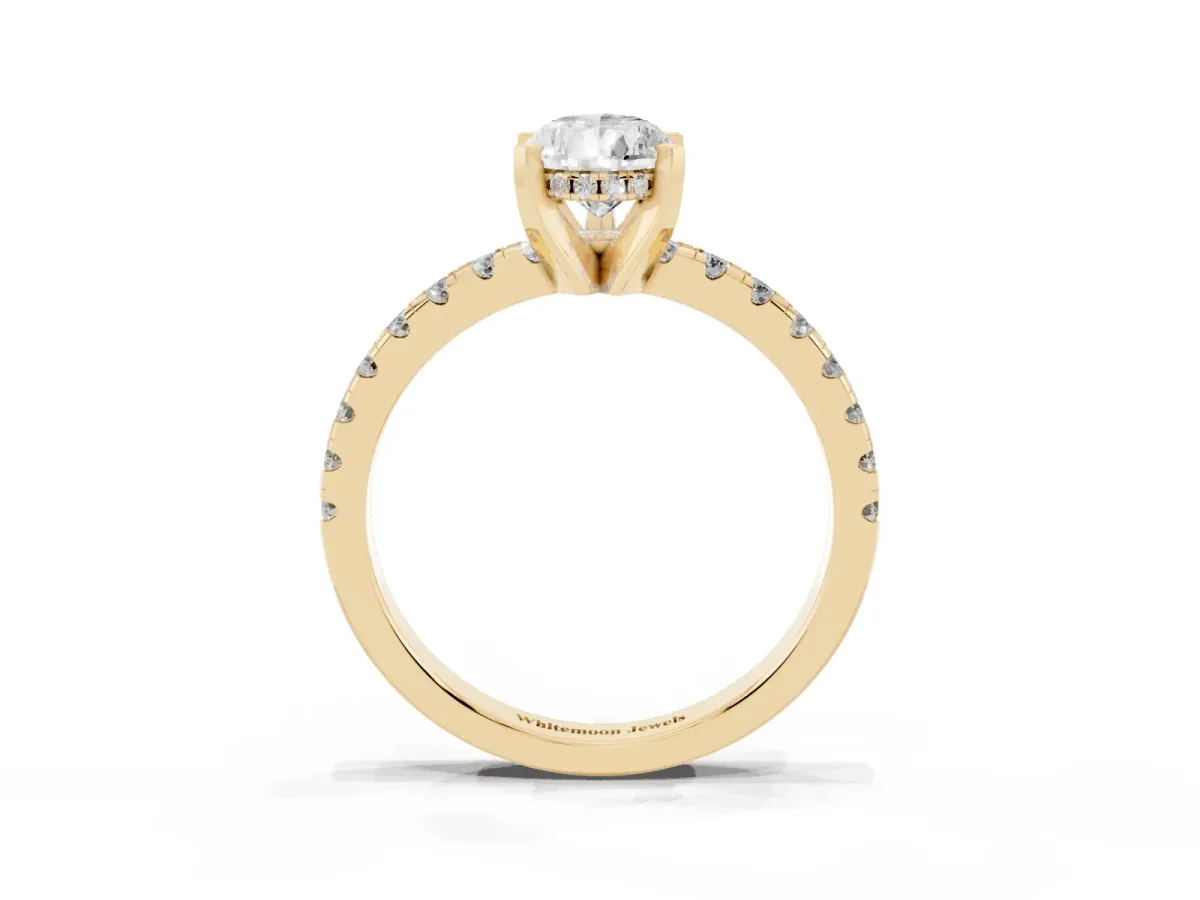 Pear Cut Diamond Solitaire Ring with Round Pavé Band and Four-Prong Setting Yellow gold