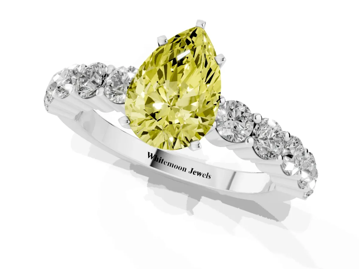 Fancy Yellow Pear Cut Diamond Solitaire Ring with Shared Prong Round Side Stones Silver