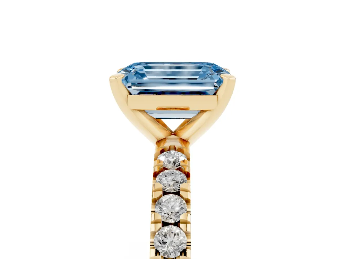 Fancy Blue Emerald Cut Diamond Pavé Band Solitaire with Four-Prong Setting Yellow gold