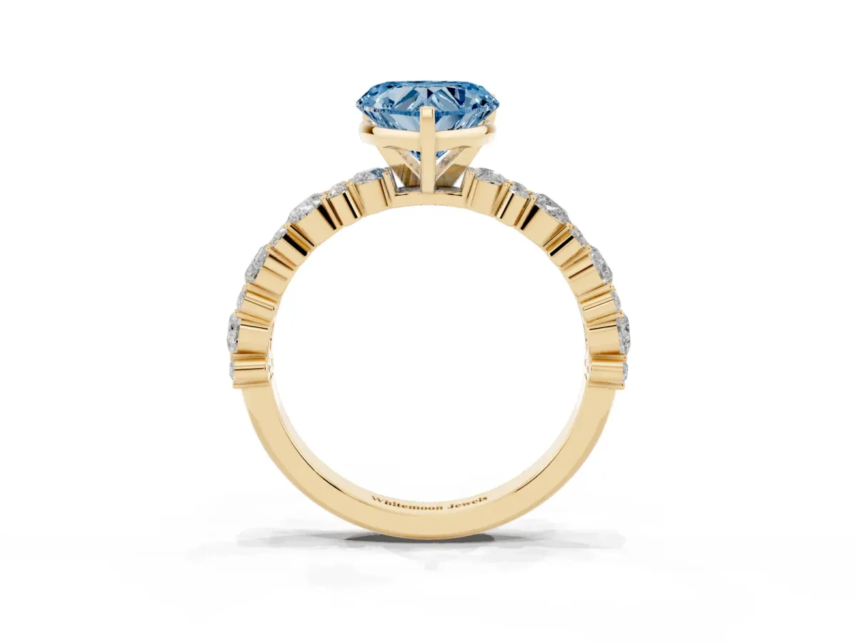 Fancy Blue Heart Cut Diamond Side Stone Solitaire Ring with Round and Four-Prong Setting Yellow gold
