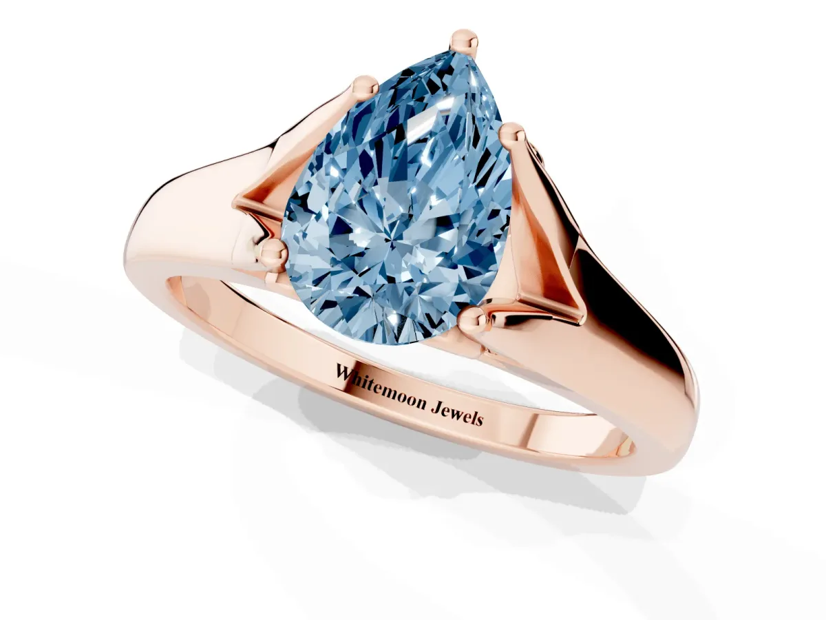 Fancy Blue Pear Cut Solitaire Diamond Ring with Cathedral Band and Four-Prong Setting Rose gold