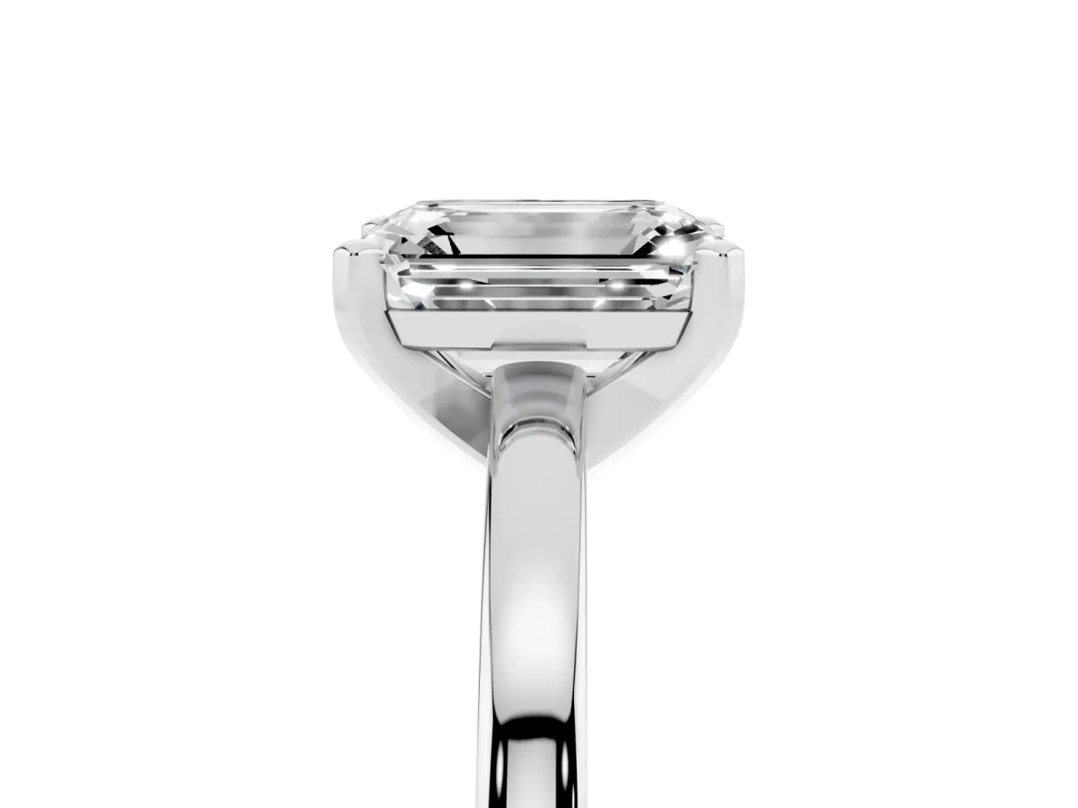 Emerald Cut Solitaire Diamond Engagement Ring with Four-Prong Setting on a Classic Band Silver