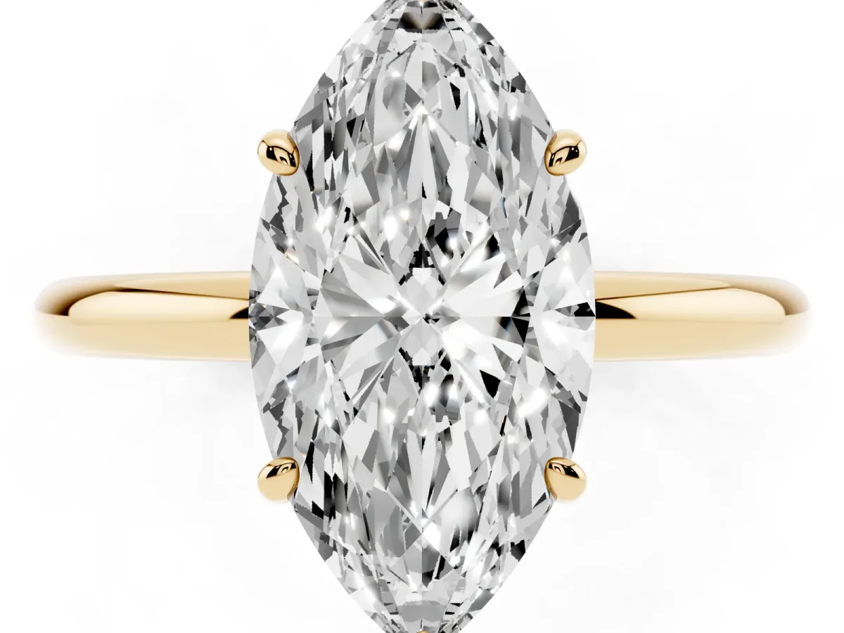 Marquise Cut Solitaire Diamond Ring with Four-Prong Setting on a Plain Band Yellow gold