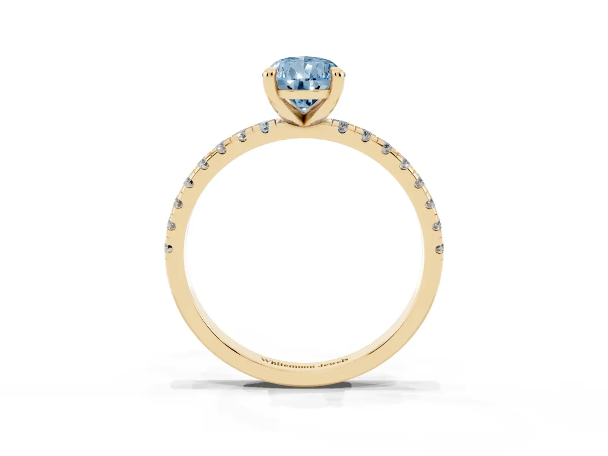 Fancy Blue Pear Cut Diamond Brilliant Solitaire Ring with Pavé Band and Four-Prong Setting Yellow gold
