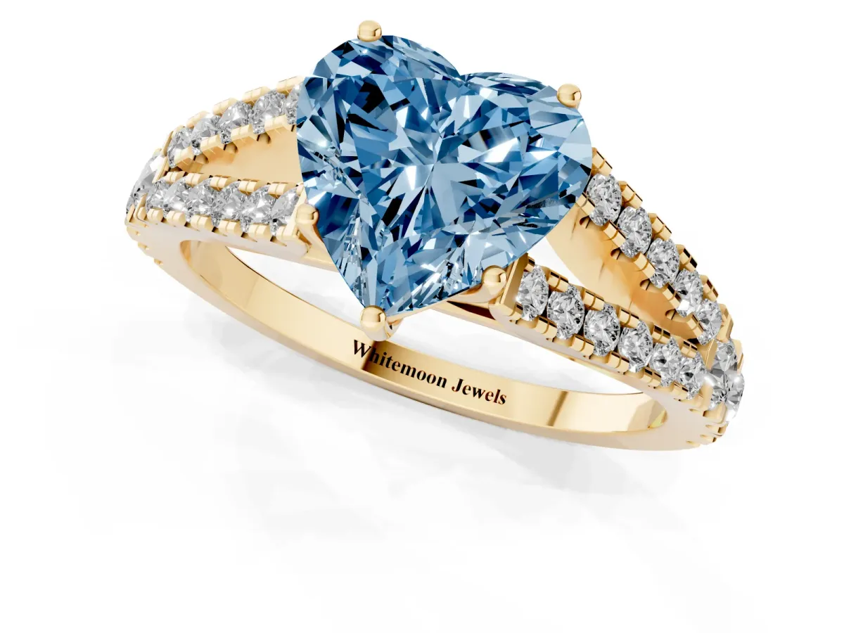Fancy Blue Heart Cut Diamond Split Shank Pavé Engagement Ring with Four-Prong Setting Yellow gold