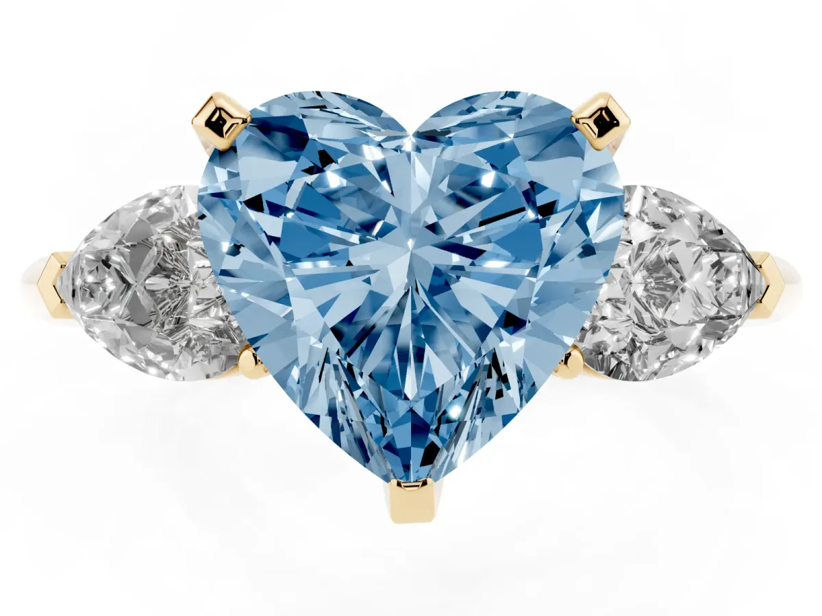 Fancy Blue Three-Stone Heart Cut Diamond Ring with Pear Side Stones and Four-Prong Setting Yellow gold