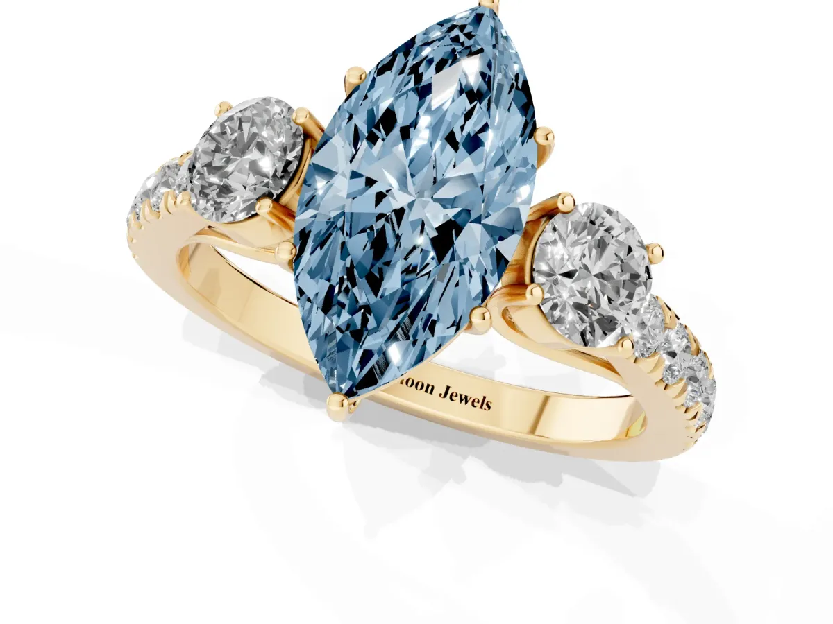 Fancy Blue Marquise Cut Cut Diamond Three-Stone Ring with Round Side Stones and Pavé Band Yellow gold