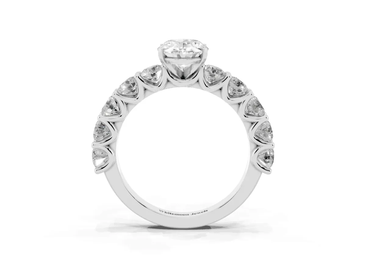 Oval Cut Diamond Prong Setting with Side Stones on a Pave Band Silver
