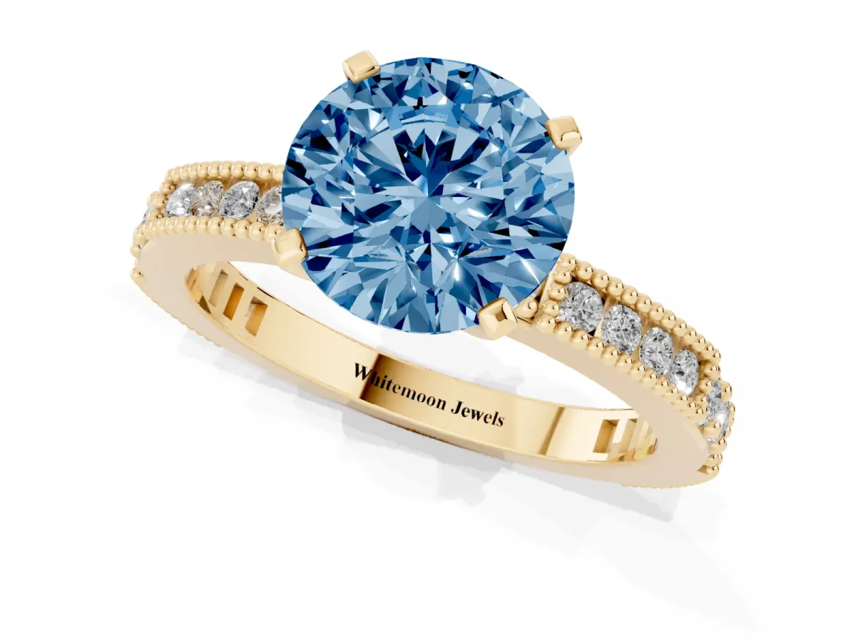 Fancy Blue Round Cut Solitaire with Pavé Band and Four-Prong Setting Yellow gold