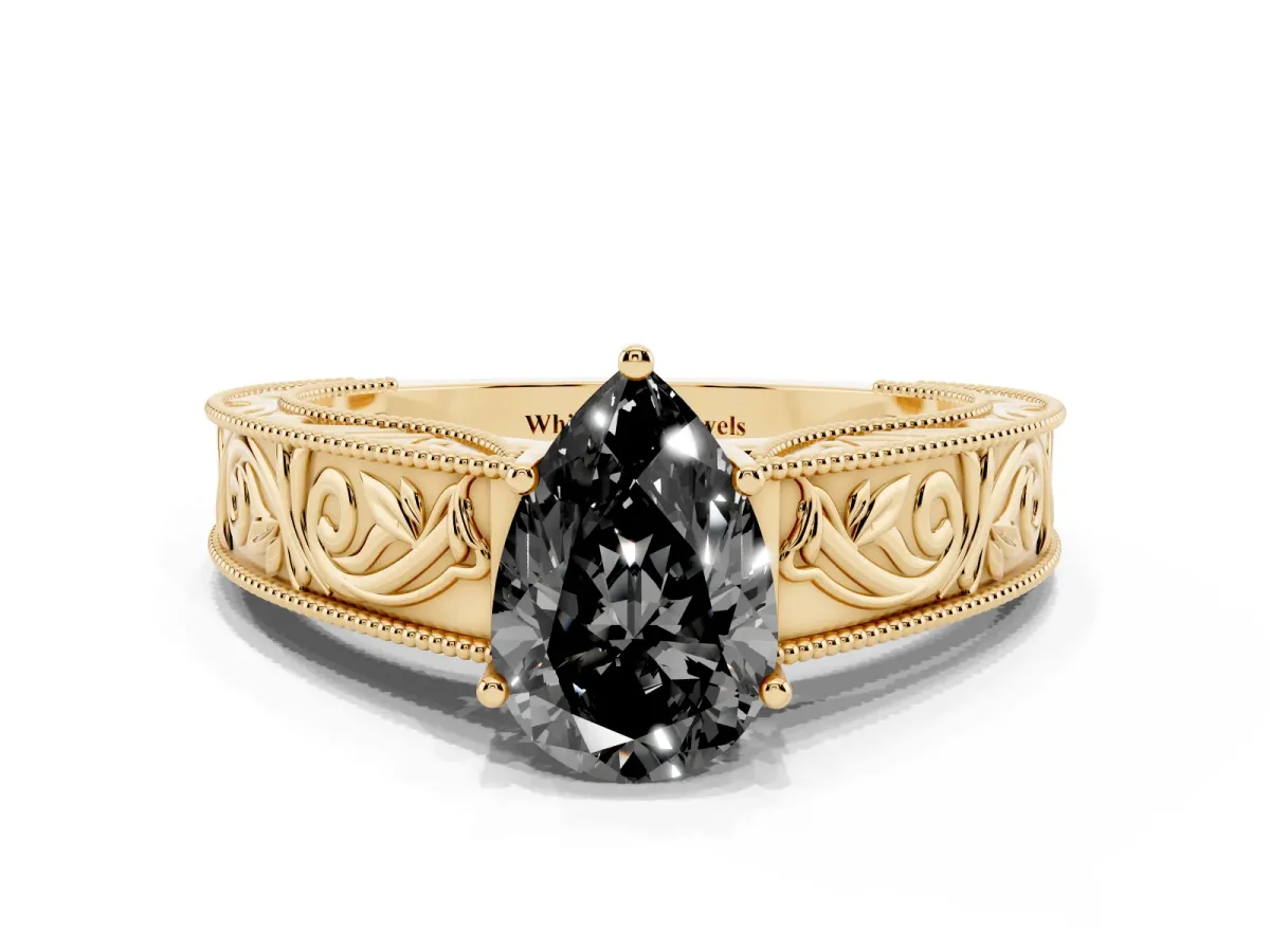 Fancy Black Pear Cut Diamond Solitaire Ring with Engraved Band and Four-Prong Setting Yellow gold