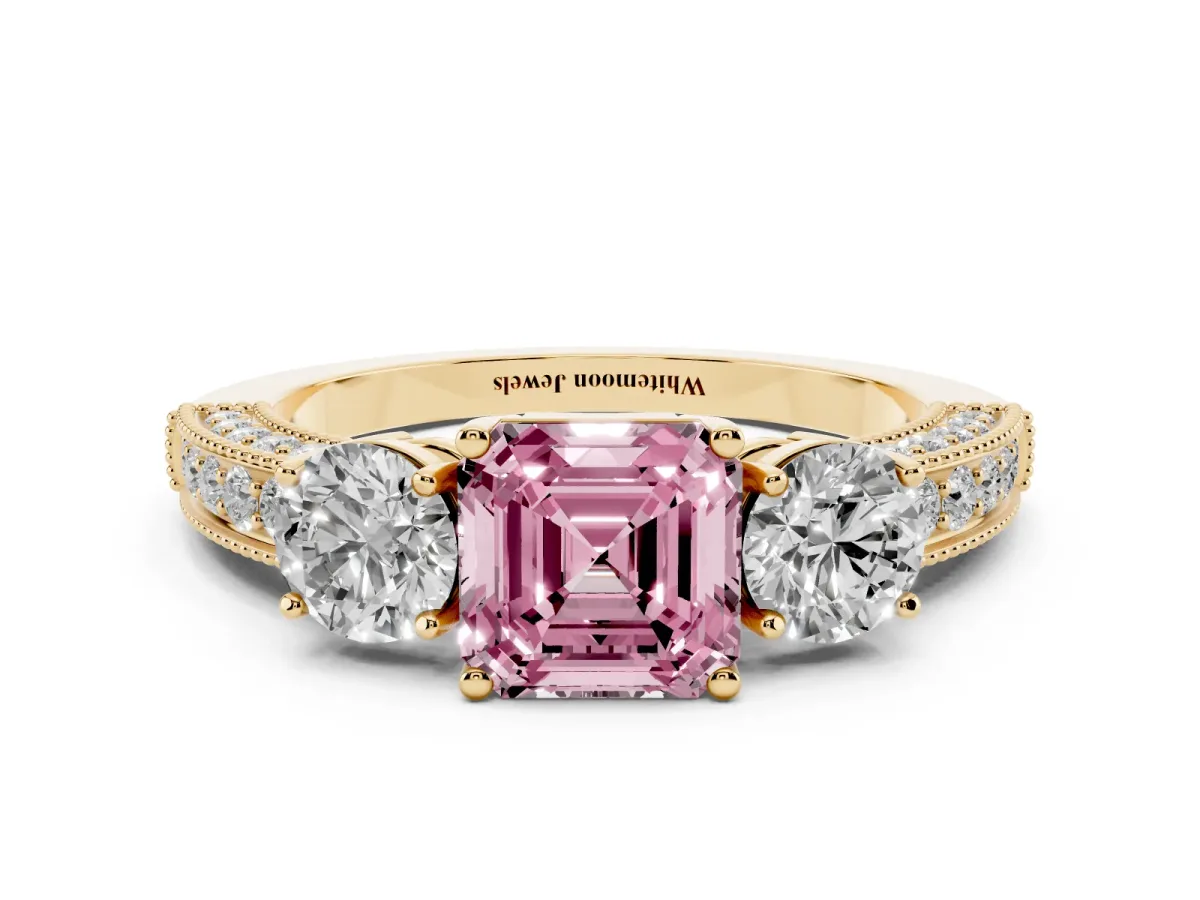 Fancy Pink Asscher Cut Three-Stone Diamond Ring with Pavé Band and Four-Prong Setting Yellow gold