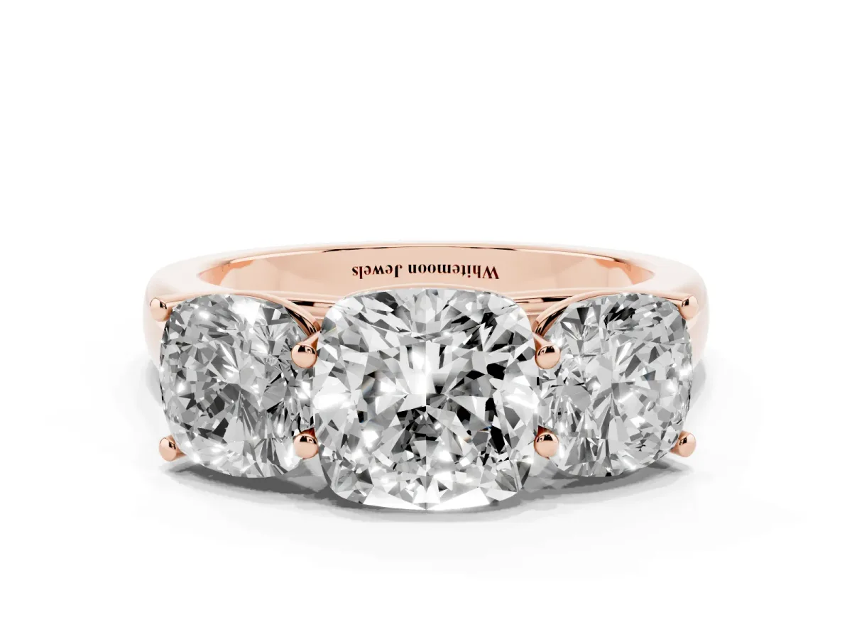 Cushion Cut Three-Stone Diamond Ring with Prong Setting on a Classic Band Rose gold