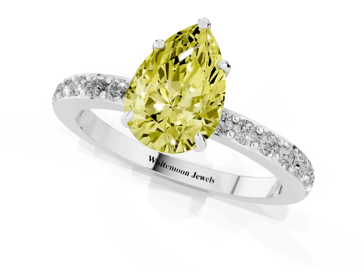 Fancy Yellow Pear Cut Diamond Pavé Engagement Ring with Round Accents and Prong Setting Silver