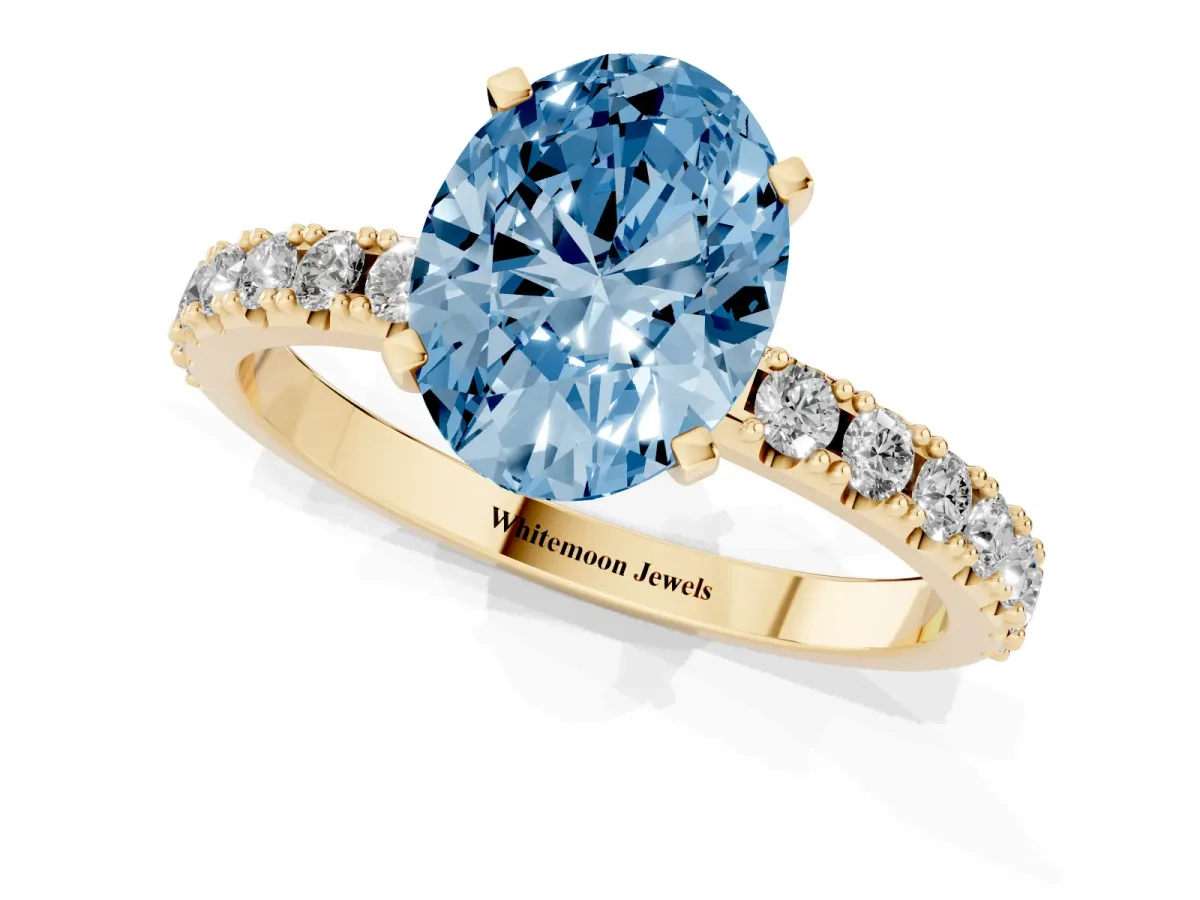 Fancy Blue Oval Cut Diamond Solitaire Pavé Band with Four-Prong Setting Yellow gold