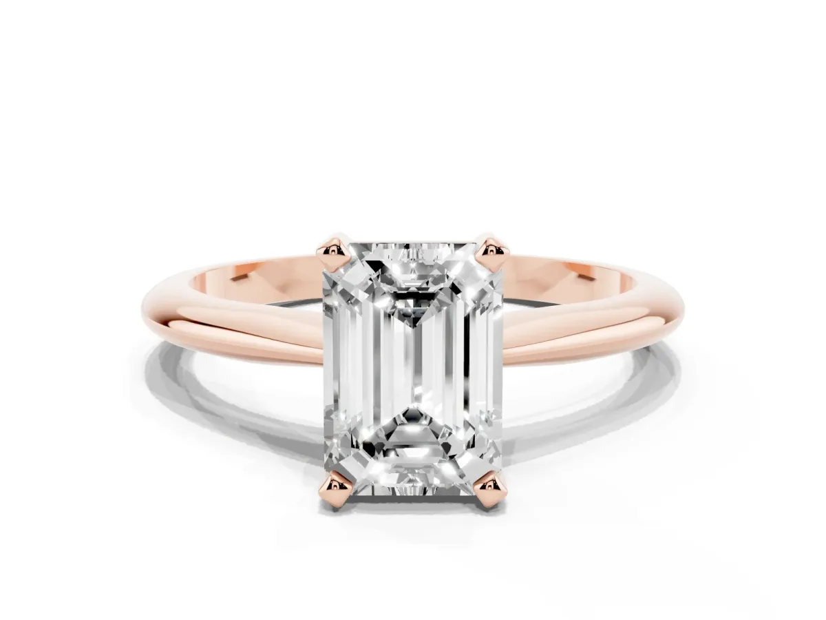 Emerald Cut Cut Solitaire Ring with Four-Prong Setting on a Classic Band Rose gold