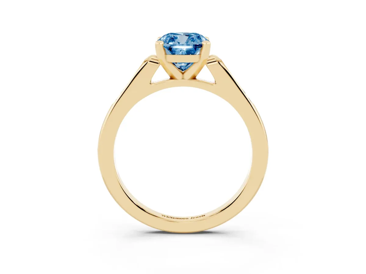 Fancy Blue Cushion Cut Diamond Solitaire Ring with Channel Set Round Band and Prong Setting Yellow gold