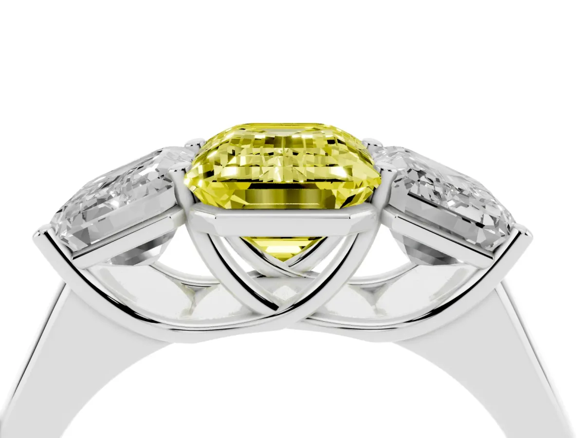 Fancy Yellow Emerald Cut Three-Stone Diamond Ring with Prong Setting on a Classic Band Silver