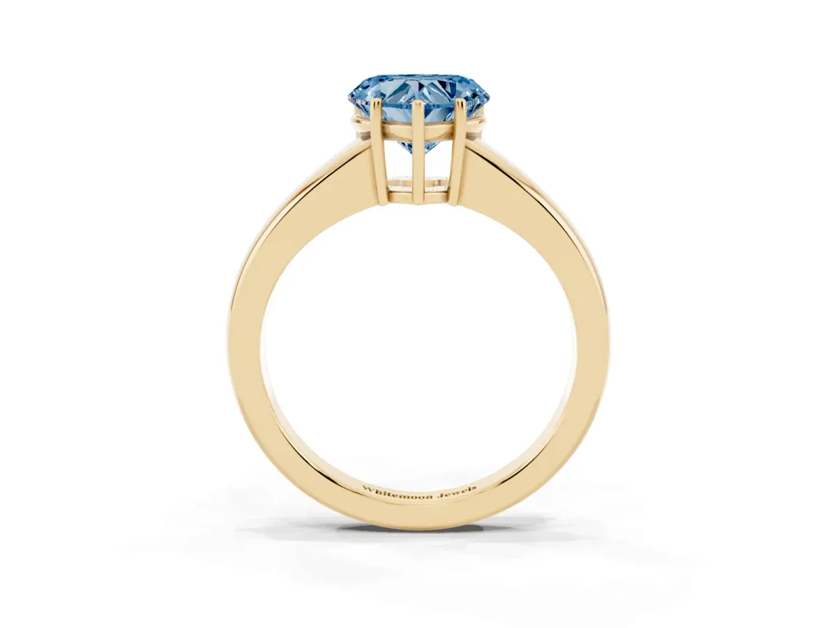 Fancy Blue Heart Cut Solitaire Diamond Ring with Tapered Band and Four-Prong Setting Yellow gold