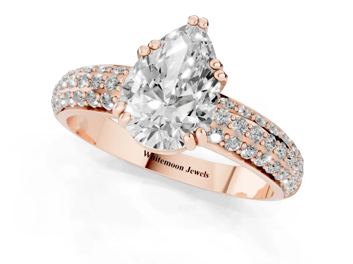 Pear Cut Diamond Solitaire Ring with Multi-Row Round Pavé Band and Prong Setting Rose gold