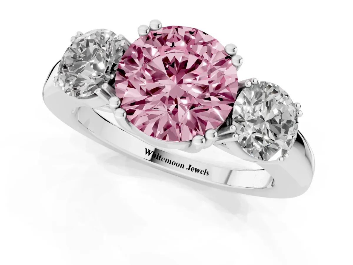 Fancy Pink Three-Stone Round Cut Cut Diamond Ring with Channel Set Band and Four-Prong Setting White gold