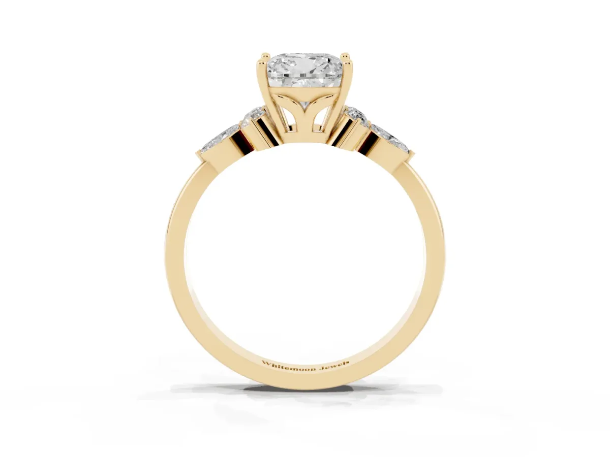 Cushion Cut Brilliant Diamond Solitaire Ring with Pear Side Stones and Four-Prong Setting Yellow gold