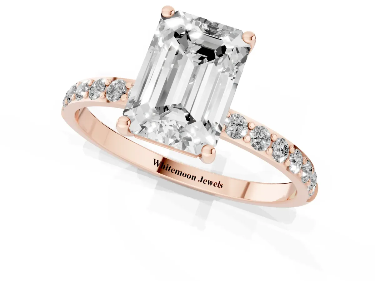 Emerald Cut Diamond Solitaire Ring with Round Pavé Shoulders and Prong Setting Rose gold
