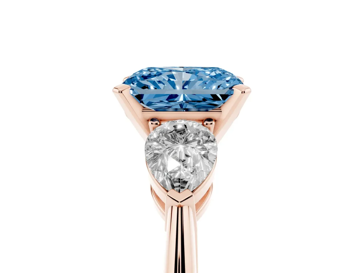 Fancy Blue Three-Stone Radiant Cut Diamond Ring with Pear Side Stones and Four-Prong Setting Rose gold