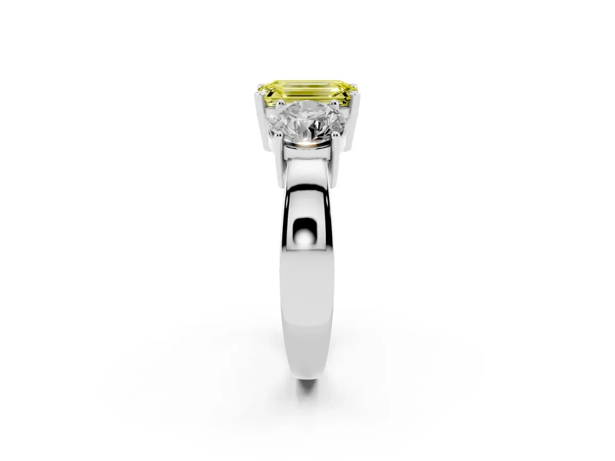 Fancy Yellow Three-Stone Emerald Cut Diamond Ring with Round Side Stones, Classic Band, and Four-Prong Setting Silver