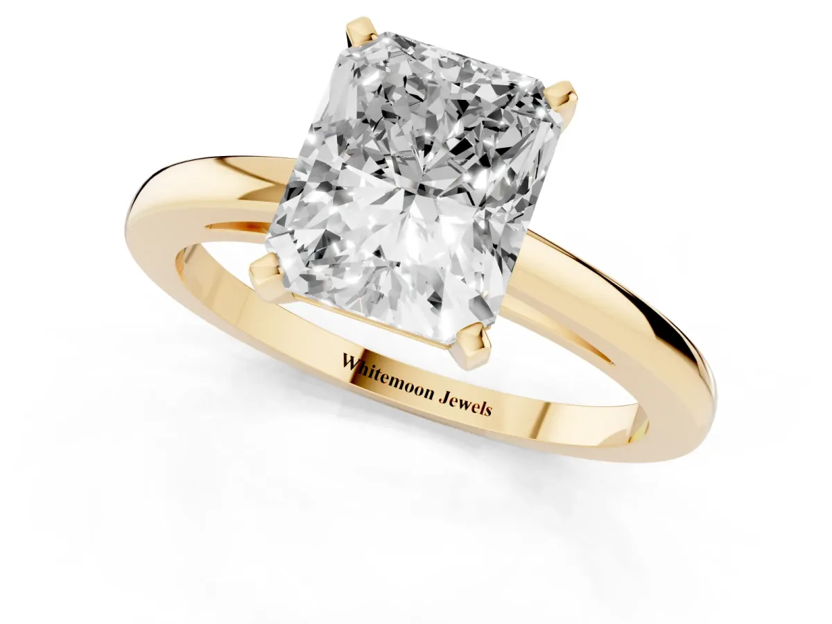 Radiant Cut Solitaire Diamond Engagement Ring with Four-Prong Setting on a Classic Band Yellow gold