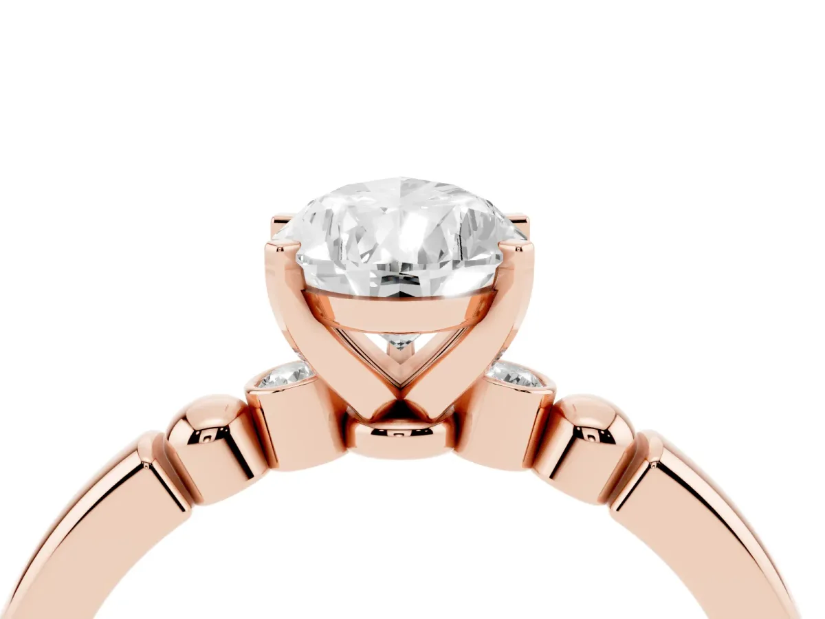 Pear Cut Solitaire Beaded Band with Four-Prong Setting Rose gold
