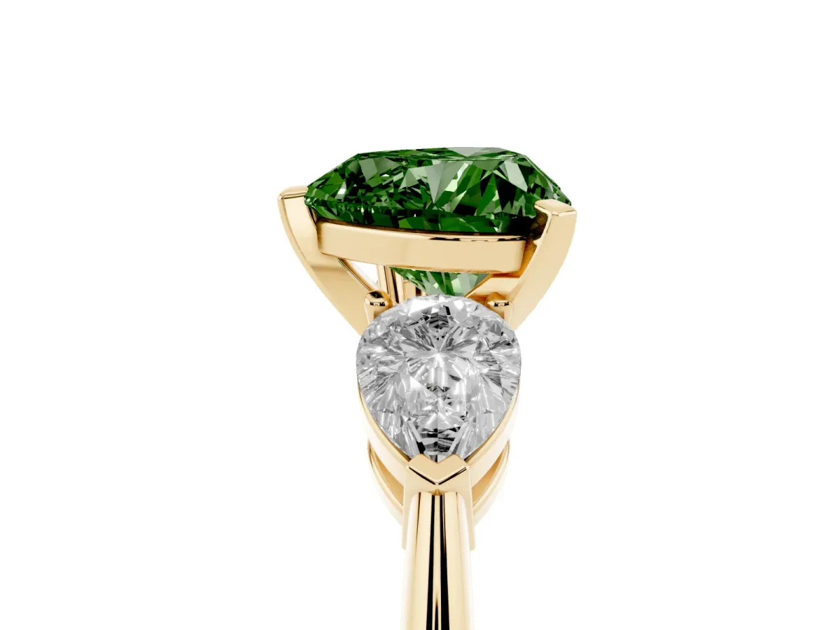 Fancy Green Three-Stone Heart Cut Diamond Ring with Pear Side Stones and Four-Prong Setting Yellow gold