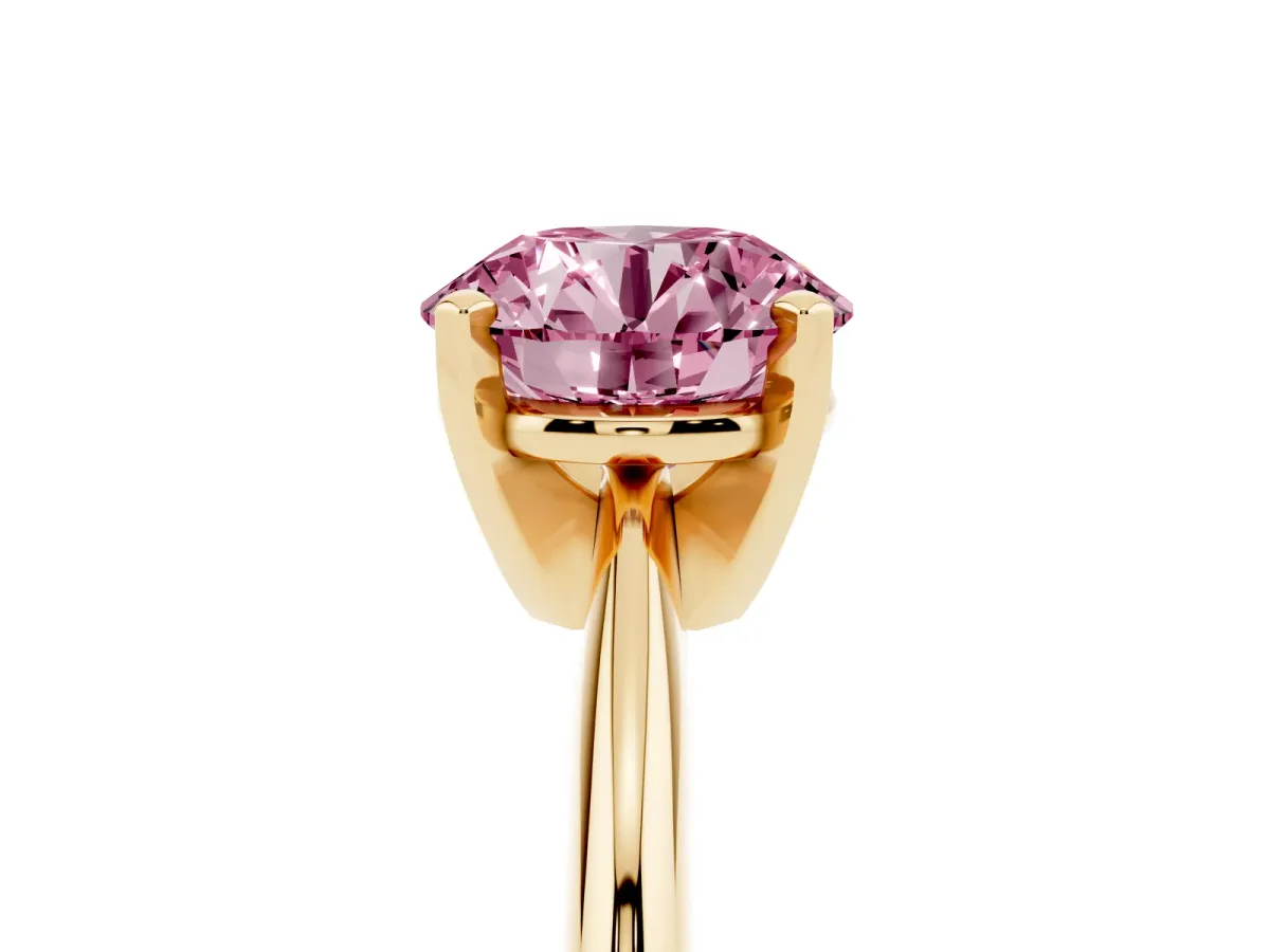 Fancy Pink Round Cut Cut Solitaire Ring with Four-Prong Setting on a Classic Band Yellow gold