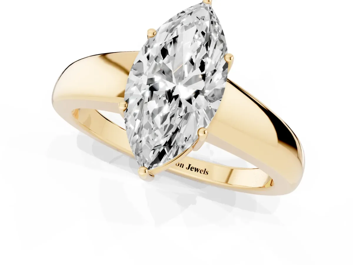 Marquise Cut Solitaire Diamond Ring with Tapered Band and Four-Prong Setting Yellow gold