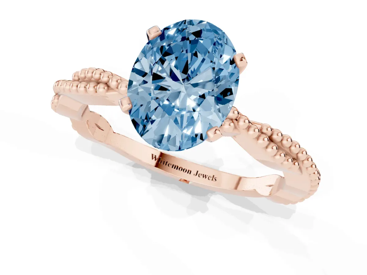 Fancy Blue Oval Cut Solitaire Twisted Band with Bead Prong Setting Rose gold