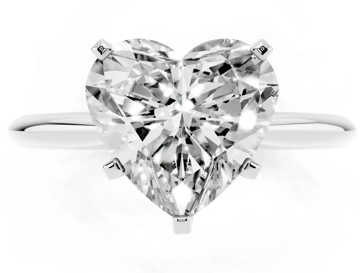 Heart Cut Cut Solitaire Ring with Four-Prong Setting on a Classic Band Silver