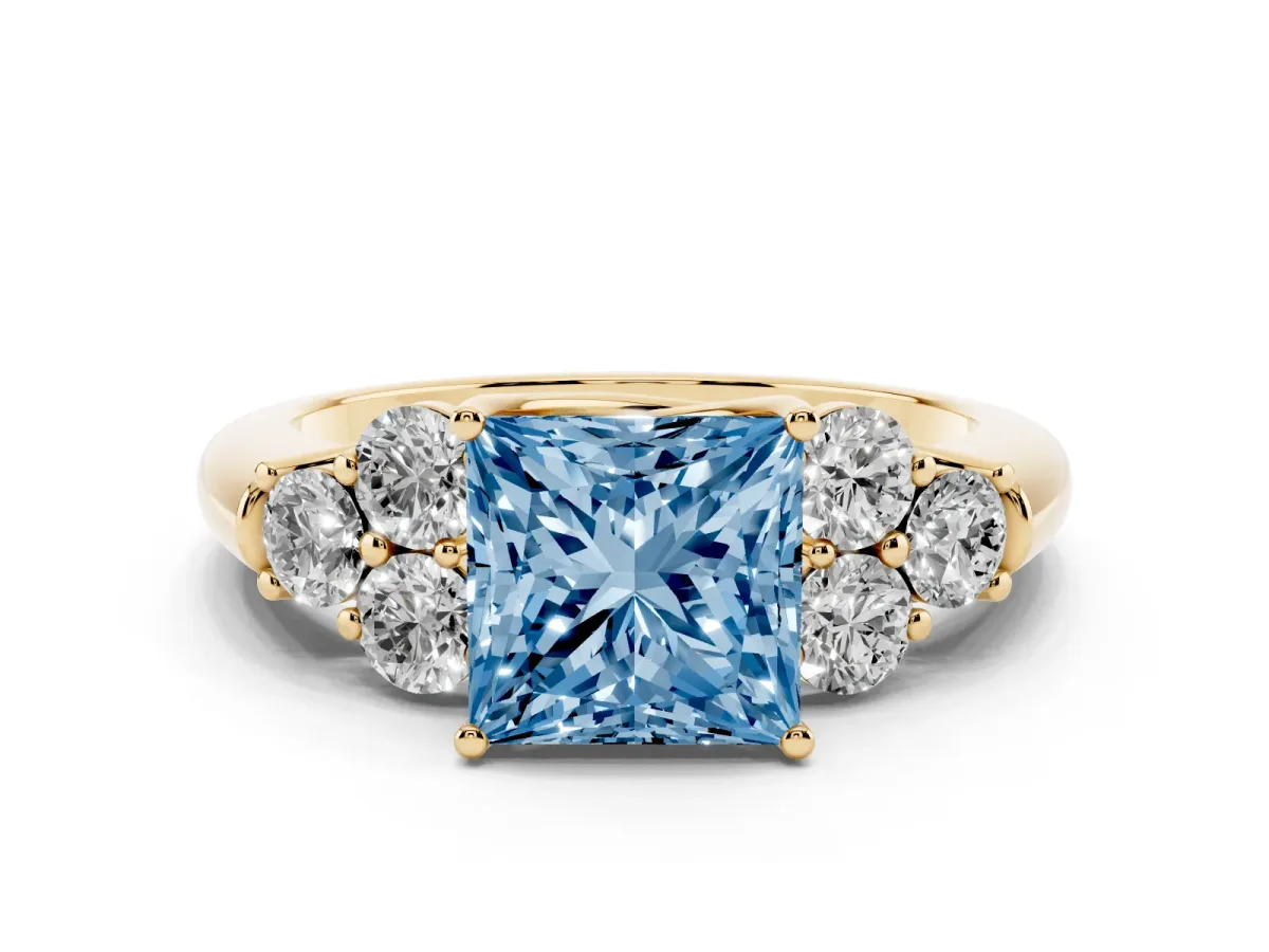 Fancy Blue Princess Cut Cut Diamond Cluster Ring with Round Accent Stones and Prong Setting on a Classic Band Yellow gold