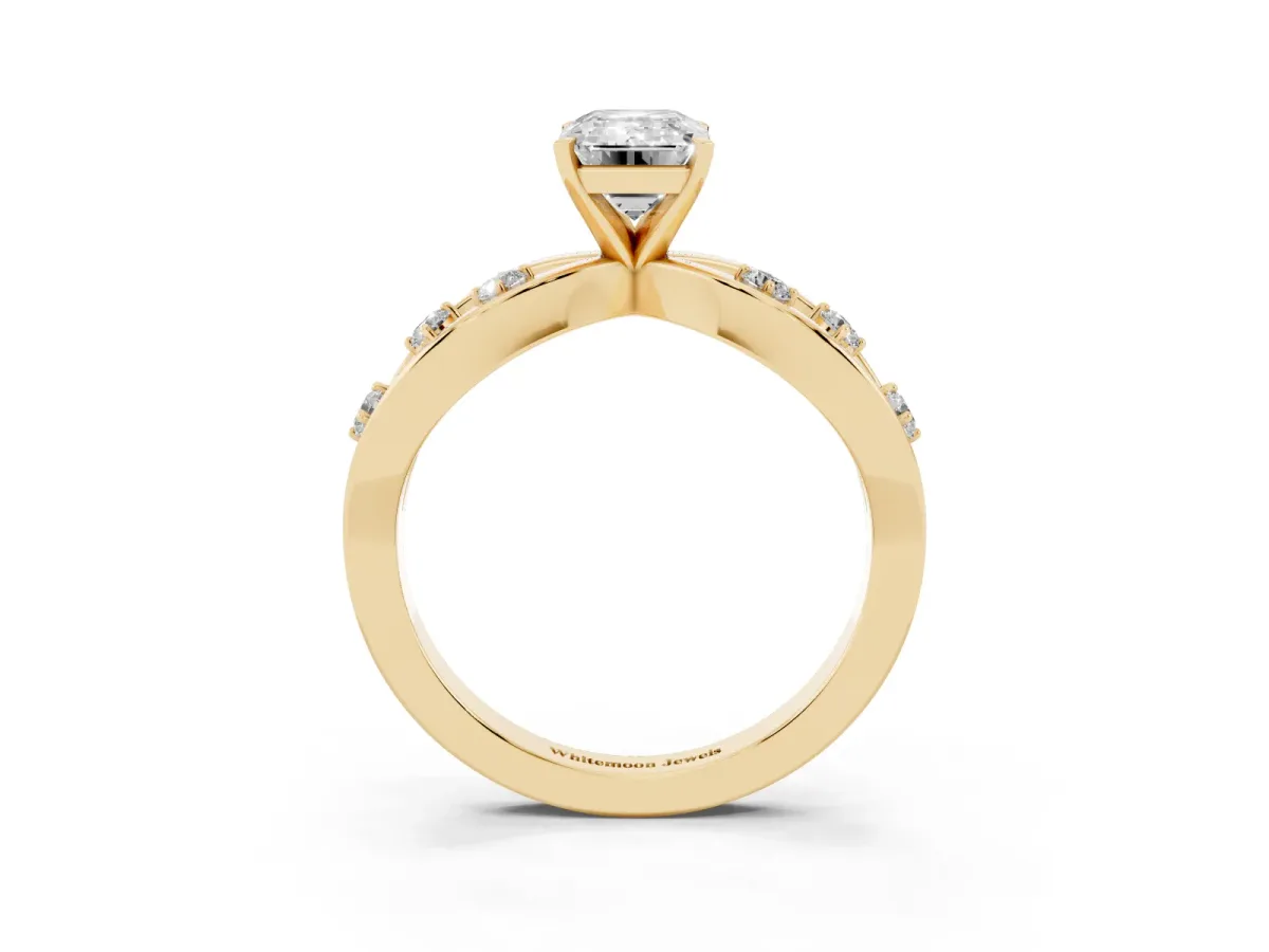 Emerald Cut Cut Solitaire Diamond with Side Stones on Criss-Cross Band and Four-Prong Setting Yellow gold