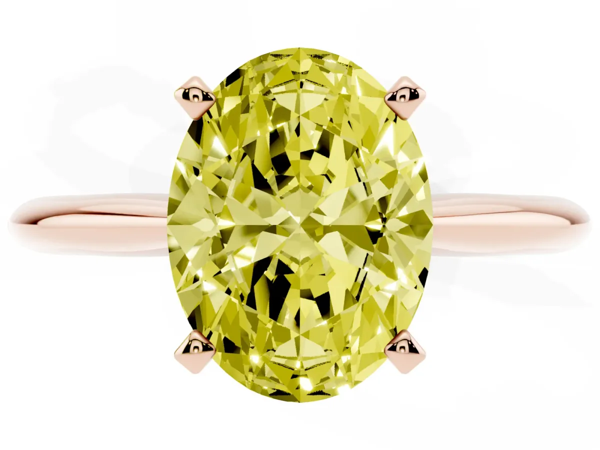 Fancy Yellow Oval Cut Cut Solitaire Ring with Four-Prong Setting on a Classic Band Rose gold