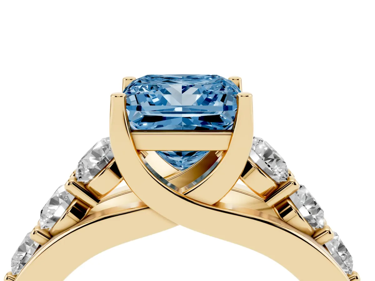 Fancy Blue Princess Cut Diamond Engagement Ring with Pavé Band and Four-Prong Setting Yellow gold