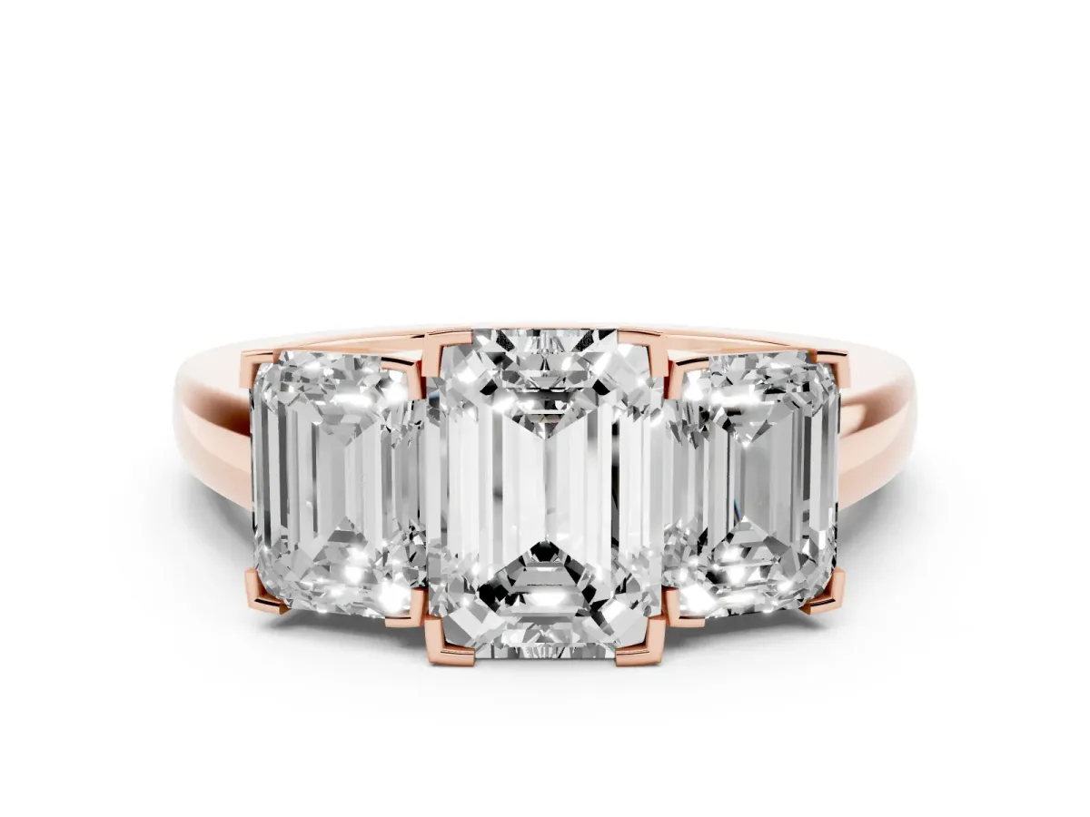 Three-Stone Emerald Cut Cut Diamond Ring with Channel Set Band and Four-Prong Setting Rose gold