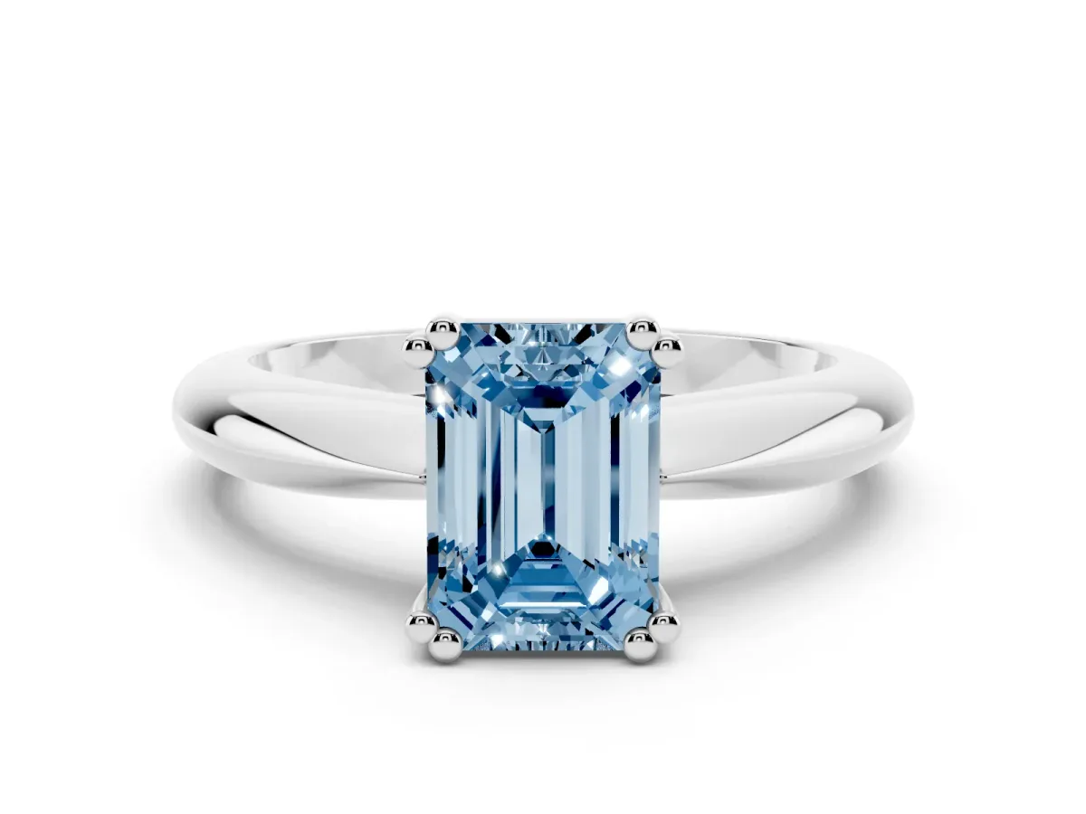 Fancy Blue Emerald Cut Cut Solitaire Engagement Ring with Tapered Band and Four-Prong Setting Silver