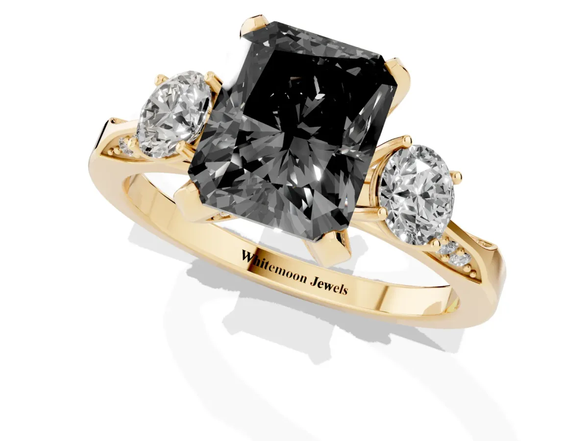 Fancy Black Radiant Cut Brilliant Three-Stone Diamond Ring with Pavé Band and Four-Prong Setting Yellow gold