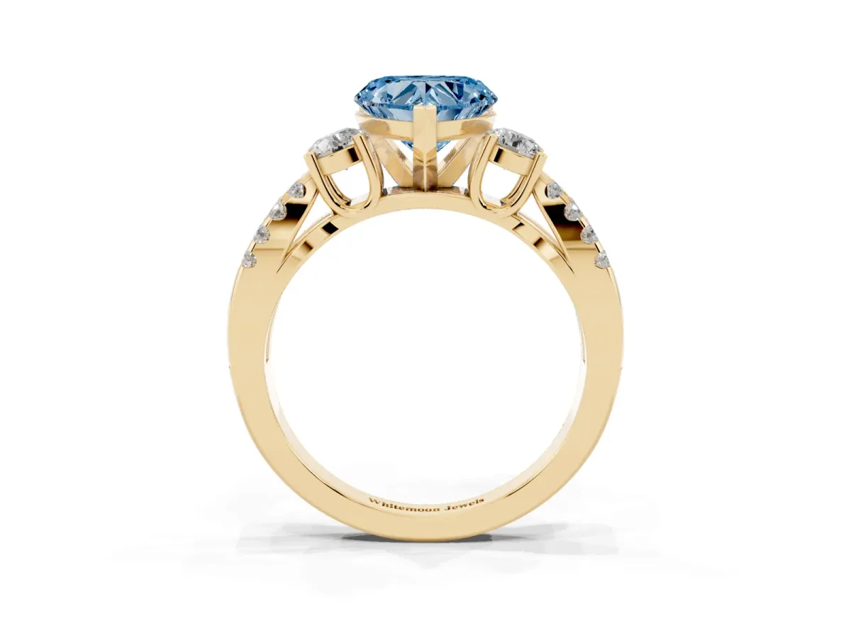 Fancy Blue Heart Cut Diamond Three-Stone Ring with Pavé Split Shank and Four-Prong Setting Yellow gold