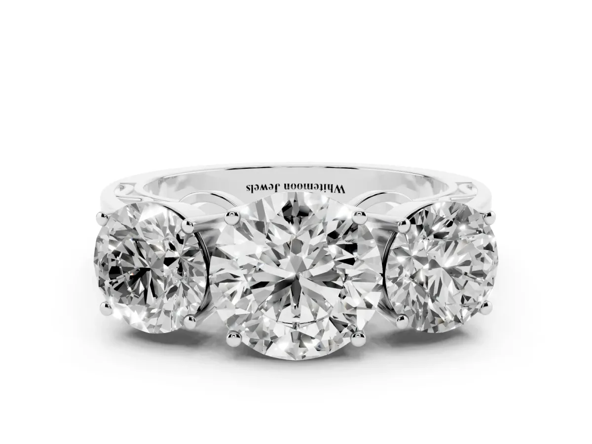 Round Cut Diamond Three-Stone Ring with Prong Setting and Textured Band Silver
