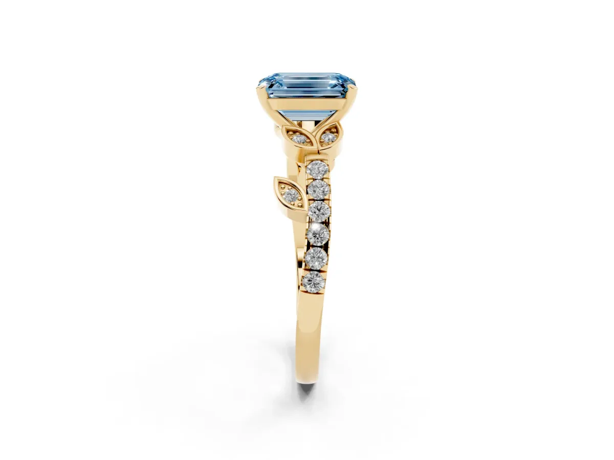 Fancy Blue Emerald Cut Solitaire Leaf-Inspired Diamond Ring with Pavé Band and Four-Prong Setting Yellow gold
