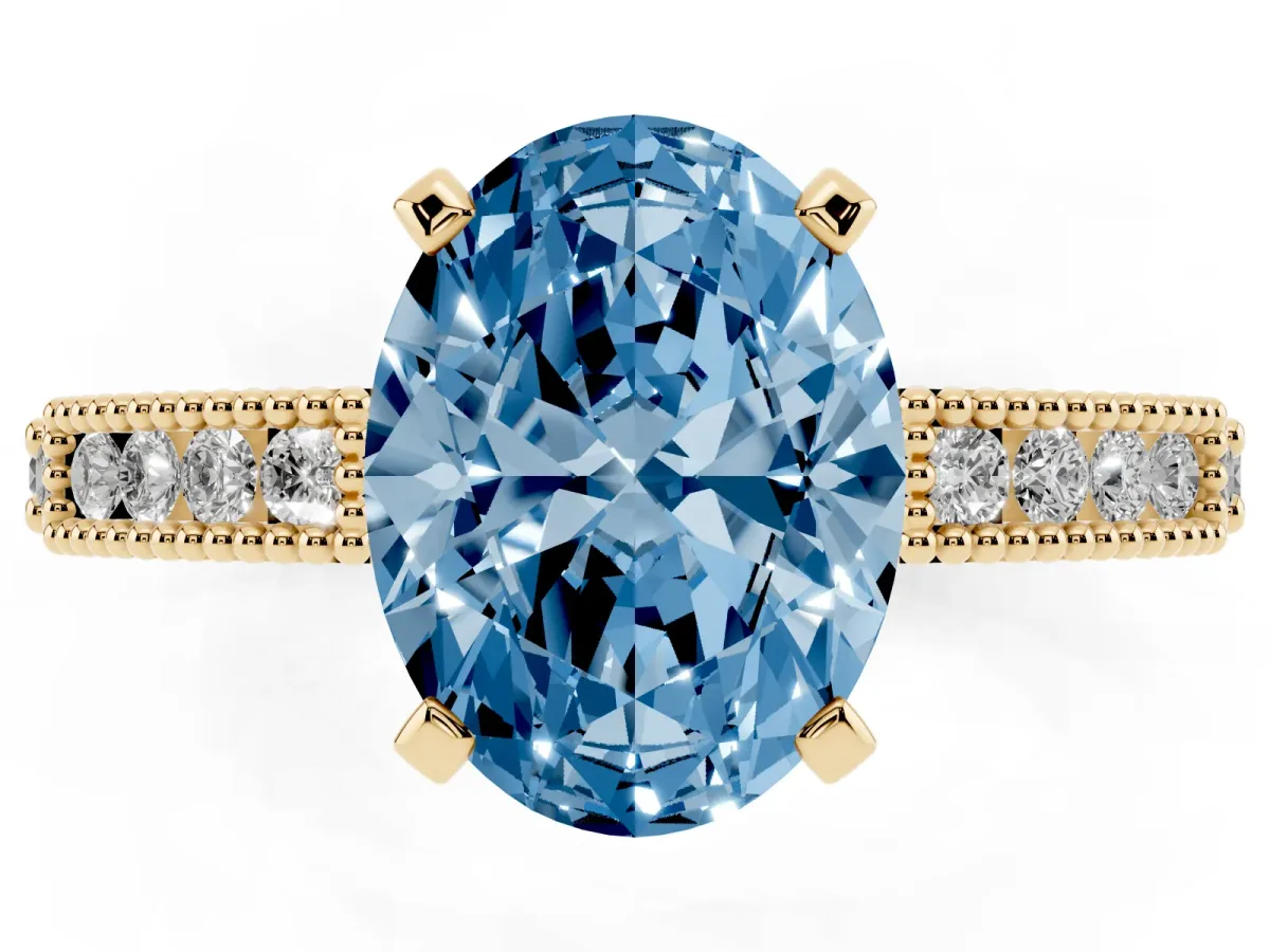 Fancy Blue Oval Cut Solitaire with Pavé Band and Four-Prong Setting Yellow gold