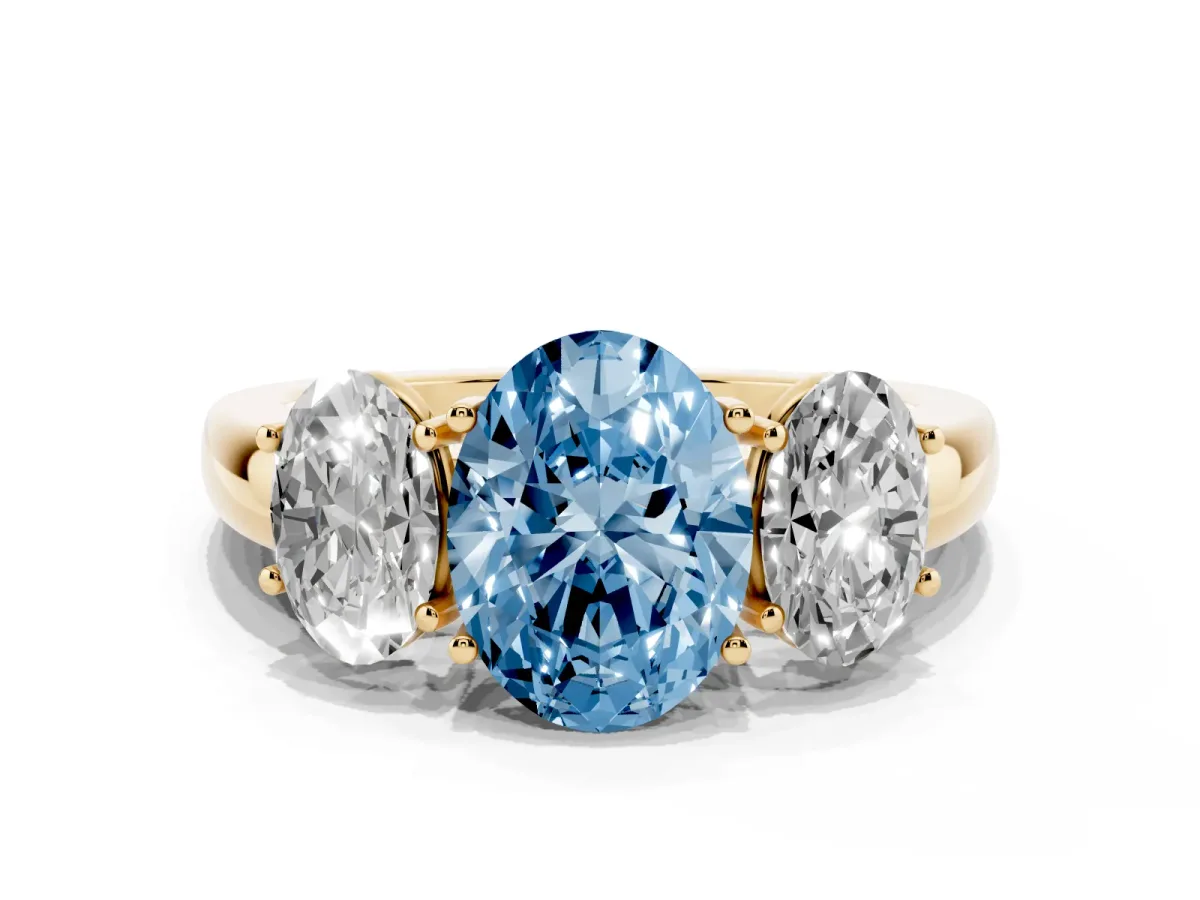 Fancy Blue Oval Cut Diamond Three-Stone Ring with Four-Prong Setting and Classic Band Yellow gold